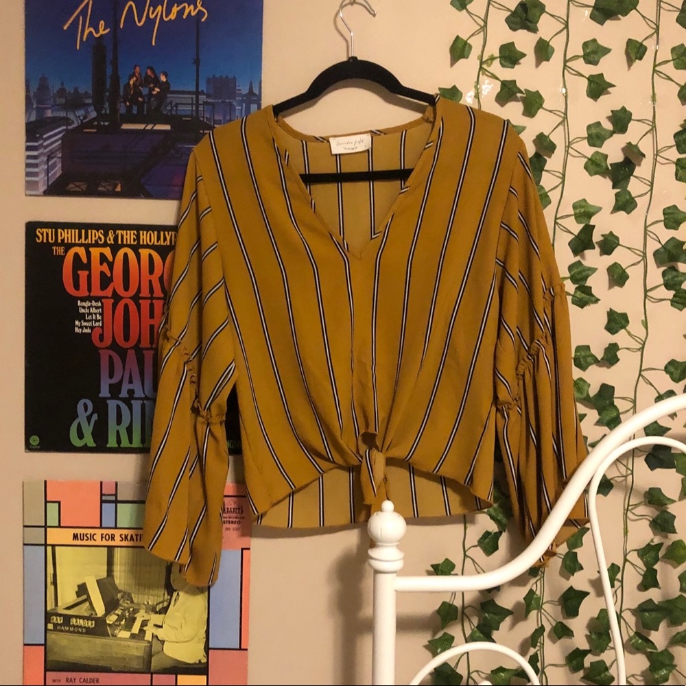 Flowy yellow top with black and white stripes!